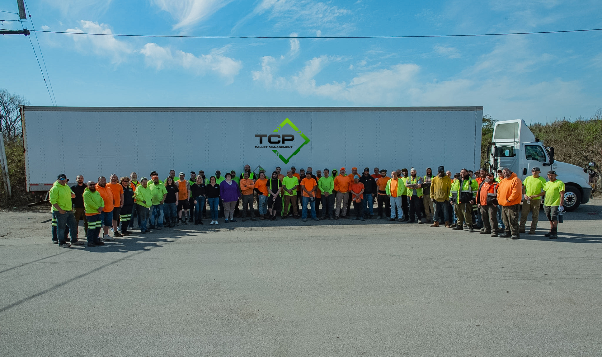 The Tri County Pallet team standing together outside the Akron yard